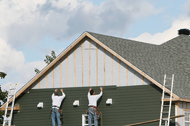 Professional Siding Contractor technician working in Leetonia, OH